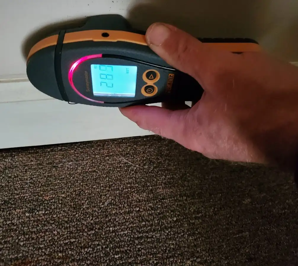 Moisture detection at baseboard during Storm Damage Restoration in Cartersville